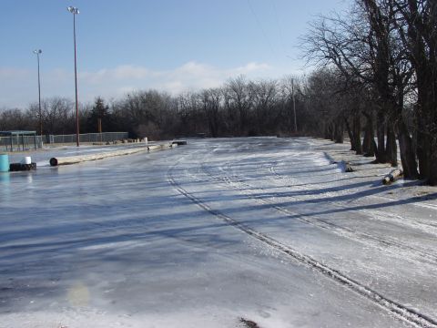 1979 Ford Bronco - A frozen track with tire marks, suggesting recent activity despite the ice.