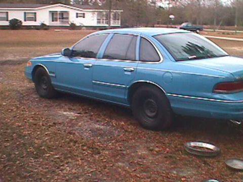 1994 Ford Crown Victoria - This 1994 Ford Crown Victoria is seen parked outdoors on a dirt lot.