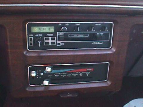 1994 Ford Crown Victoria - Close-up of a car's dashboard, showing the radio and climate control panel.