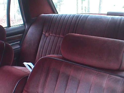 1994 Ford Crown Victoria - Interior view of maroon velour car seats.