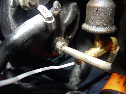 1986 Ford Bronco - Next, before you slack any mounting bolts, crack loose the high pressure hose fitting. It's easier now than when the pump is loose and hard…