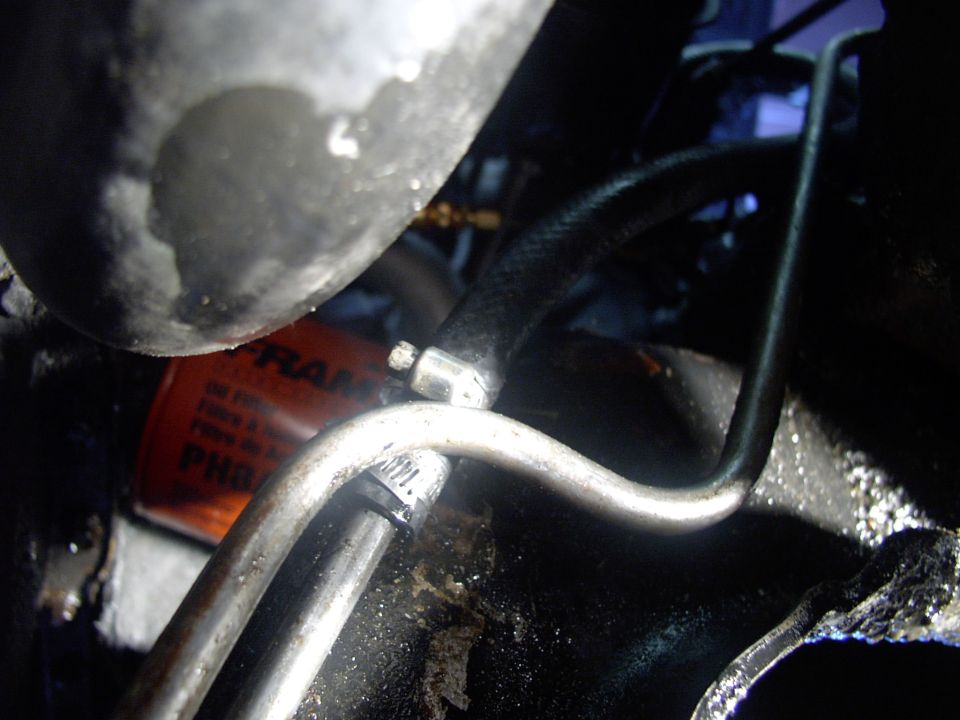 Now that the flushing is done I removed the clear hose and installed the new PS hose with two opposed hose clamps as seen here.