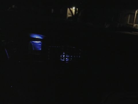 1995 Ford Contour - The dimly lit interior of a vehicle shows illuminated dashboard components.