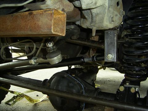 1995 Ford Bronco - Undercarriage view shows steering components and suspension parts of a vehicle.