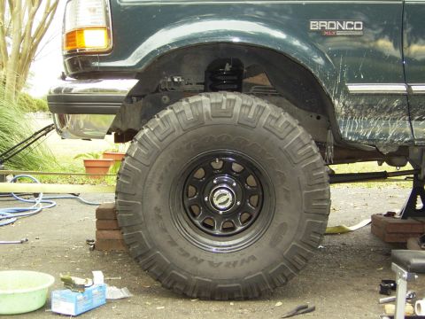 1995 Ford Bronco - Close-up of the front wheel and fender of a 1995 Ford Bronco XLT.