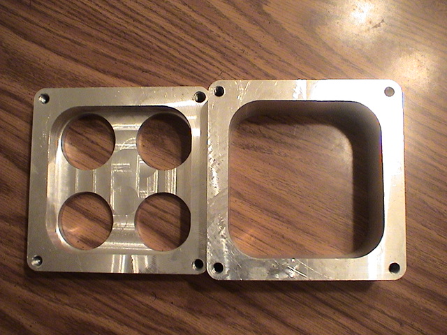 custom Made CNC dominator carb spacers. Made how ever tall you want it. 
email me if interested 
Theemudracer@aol.com