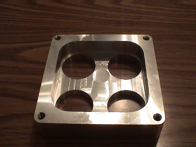 custom Made CNC dominator carb spacers. Made how ever tall you want it. 
email me if interested 
Theemudracer@aol.com