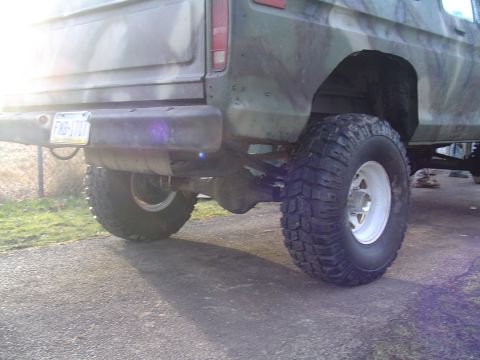 1990 Ford Bronco - This lifted Ford Bronco features a camouflage paint job and aftermarket wheels.