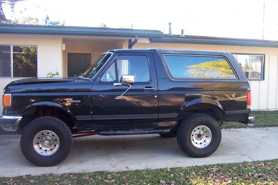 Black 1989 Ford Bronco side view with "Bronco" badge visible