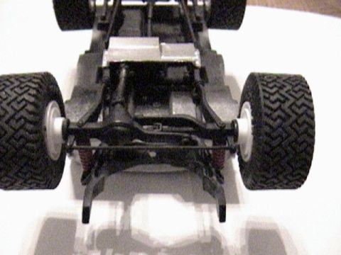 1979 Ford Bronco - Underside view of a model vehicle chassis, showing the suspension and tires.