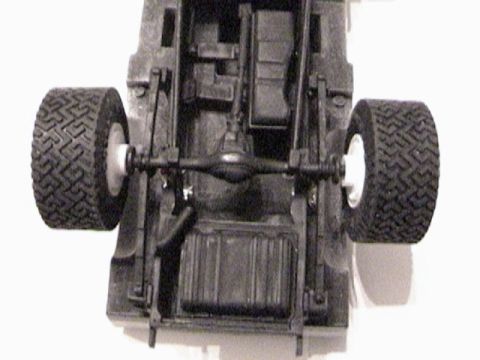 1979 Ford Bronco - This is a close-up view of the undercarriage of a model vehicle, showing its drivetrain components.