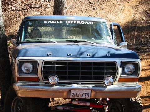 1978 Ford Bronco - Front view of a blue 1978 Ford Bronco, an "EAGLE OFFROAD" decal on the windshield and a Texas license plate.