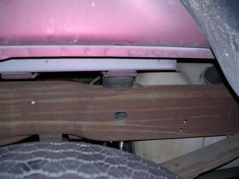 1995 Ford Bronco - Close-up view of a body lift kit installed on a vehicle's frame and body.