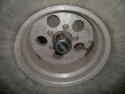 1993 Ford Bronco - This is a close-up view of a vehicle's wheel, a manual locking hub and tire tread.