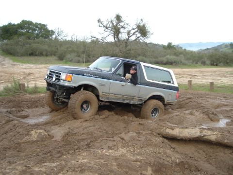 1989 Ford Bronco - This 1989 Ford Bronco is shown tackling a challenging muddy terrain during an off-road excursion.