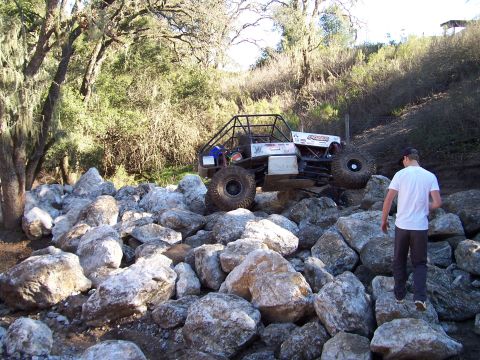 1998 Ford Ranger - A custom off-road buggy navigates a challenging rocky terrain.