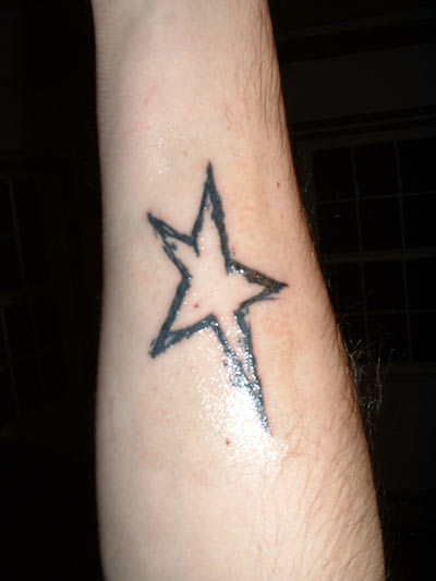 1993 Ford Probe - A tattoo of a star is visible on a person's arm.
