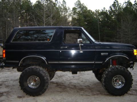 1989 Ford Bronco - This lifted 1989 Ford Bronco sits high on large tires, ready for off-road adventures.