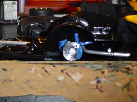 1979 Ford Bronco - A close-up view of a model car's chassis, showing the suspension and exhaust system.