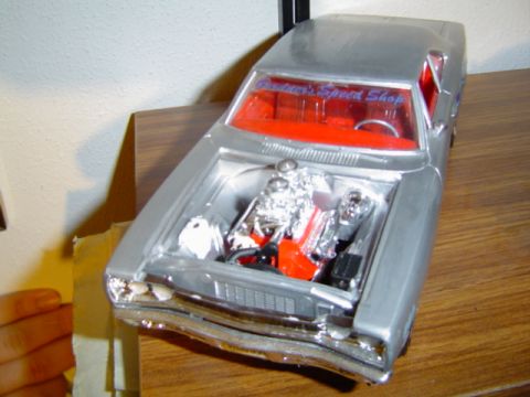 1979 Ford Bronco - This is a model car, not a 1979 Ford Bronco, with a detailed engine bay and custom text on the windshield.
