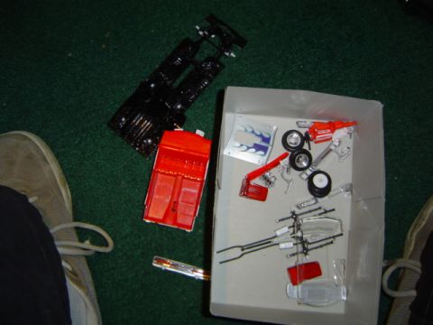 1979 Ford Bronco - Model car components are spread out, suggesting assembly or a project in progress.