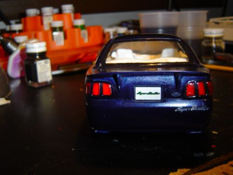 1979 Ford Bronco - A model car sits on a table with hobby supplies in the background.