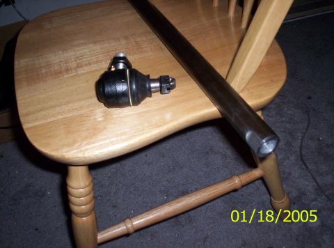 1983 Ford Bronco - A ball joint and tie rod are pictured on a wooden chair, with a date stamp of 01/18/2005.