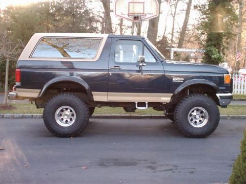 1989 Ford Bronco - This Ford Bronco has a two-tone paint scheme and appears to be from the late 1980s.