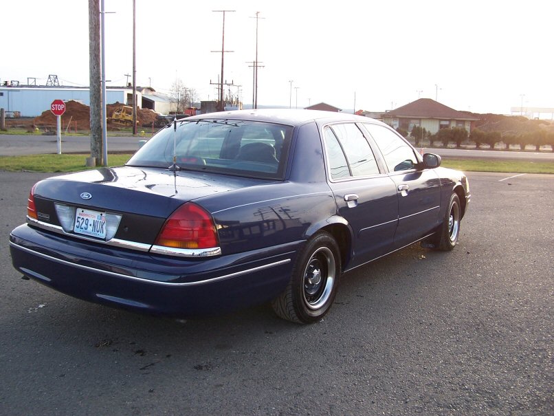 1998 Ford Crown Victoria, rear quarter view. License plate 529-NUK
