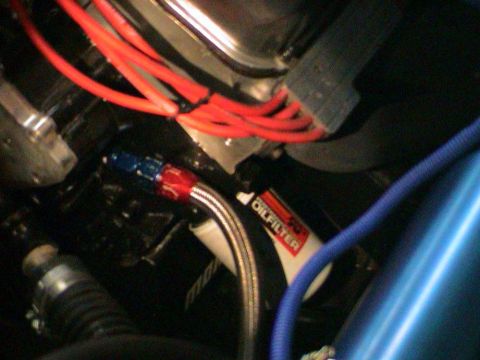 1979 Ford Bronco - Close-up view of an engine oil filter with associated plumbing and wiring.