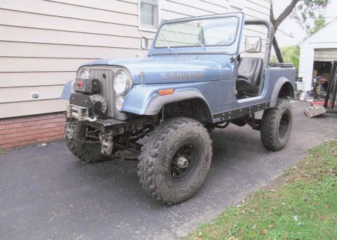 1984 Jeep Wrangler - Blue Jeep CJ-7 Laredo, likely from the early 1980s, equipped with a front winch.