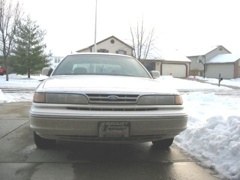 1997 Ford Crown Victoria - Front view of a 1997 Ford Crown Victoria parked in a snowy driveway.