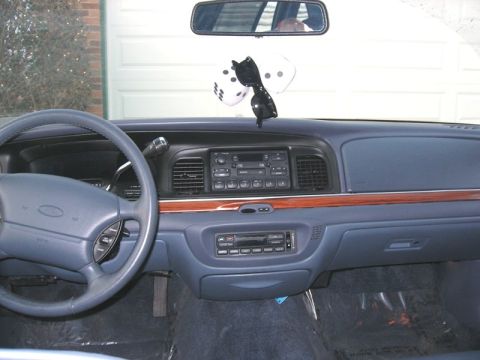 1997 Ford Crown Victoria - The interior of a 1997 Ford Crown Victoria shows the dashboard, steering wheel, and center console.