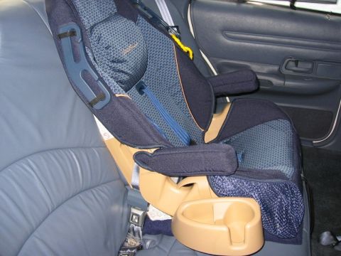 1997 Ford Crown Victoria - A child car seat is installed in the rear passenger seat of a 1997 Ford Crown Victoria.