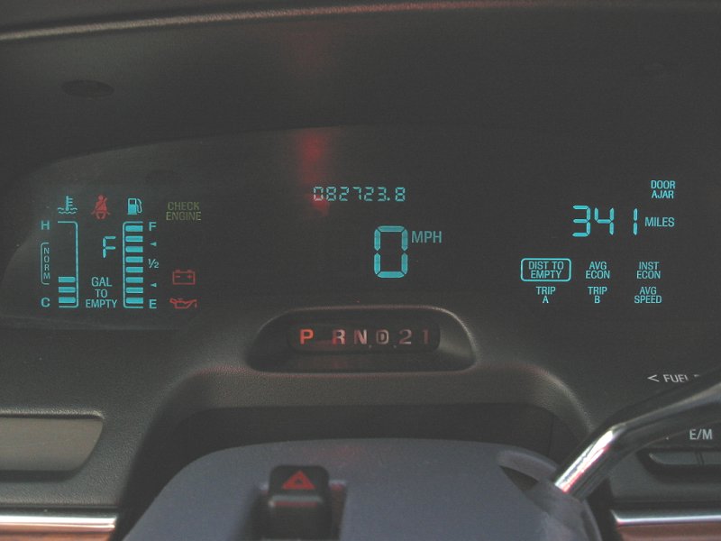 Digital dashboard showing 0 MPH, odometer 082723.8, and fuel gauge