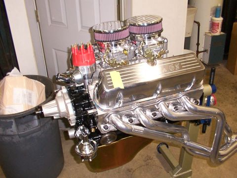 1978 Ford Mustang II - A V8 engine with chrome valve covers and dual carburetors sits on a stand.