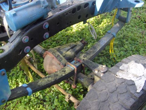 1989 Ford Bronco - Frame and suspension components of a Ford Bronco, possibly undergoing restoration.