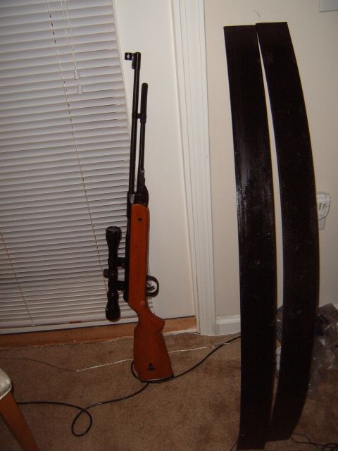 1988 Ford Bronco - An air rifle and two leaf springs are shown indoors, with a Supermotors.net watermark at the bottom.