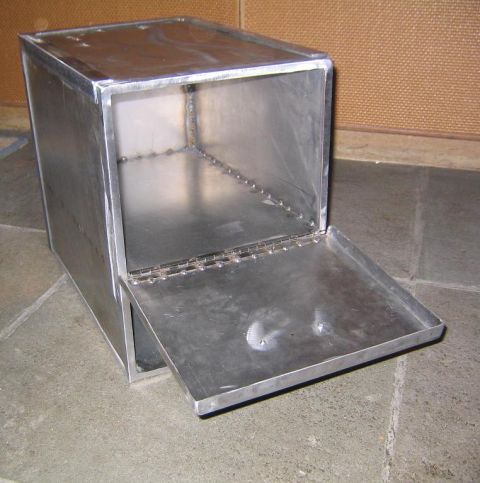 1978 Ford Bronco - A custom-made metal box with a hinged door sits on a tiled floor.