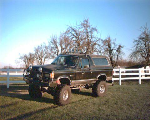 1990 Ford Bronco - This lifted 1990 Ford Bronco is equipped with a front bull bar and large off-road tires.