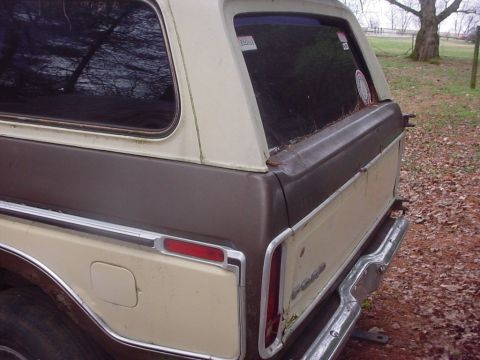 1979 Ford Bronco - Rear view of a 1978 Ford Bronco, showing its distinctive two-tone paint scheme and chrome accents.