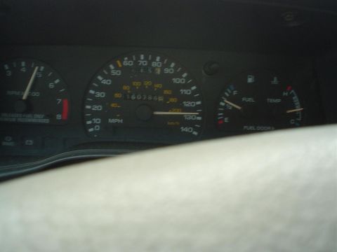 1993 Ford Taurus - The car's interior displays a dashboard with various gauges, including a speedometer and odometer showing 160,786 miles.