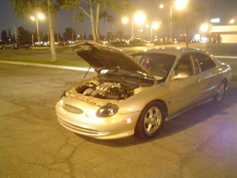 1993 Ford Taurus - The front end styling and headlights suggest a mid-to-late 1990s model.