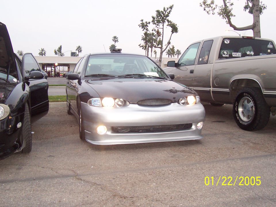 1998 Mercury Sable front with aftermarket bumper and dark hood