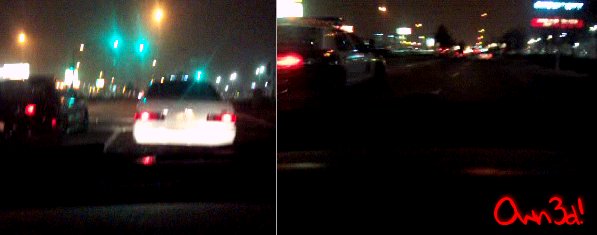Cars driving on a highway at night, traffic lights visible