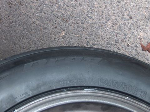 1996 Ford Probe - Close-up of a tire with visible brand and size markings on the sidewall.