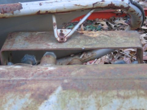 1989 Ford F-150 - Close-up of heavily rusted metal components, possibly from a vehicle or equipment.