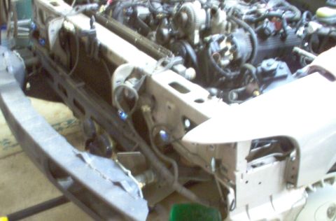 1994 Ford Crown Victoria - Front end of a 1994 Ford Crown Victoria disassembled to reveal the engine bay.