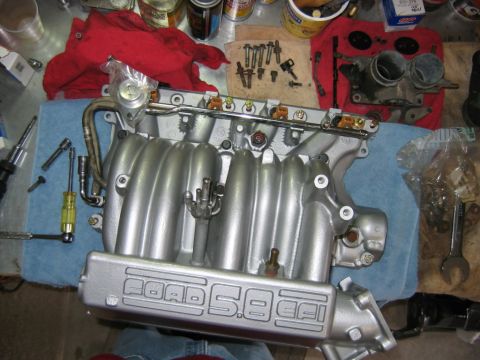 1992 Ford Bronco - View from the top. The hardest bolt is the center one on the upper intake that uses a torx bit. You'll need to get creative with your exten…