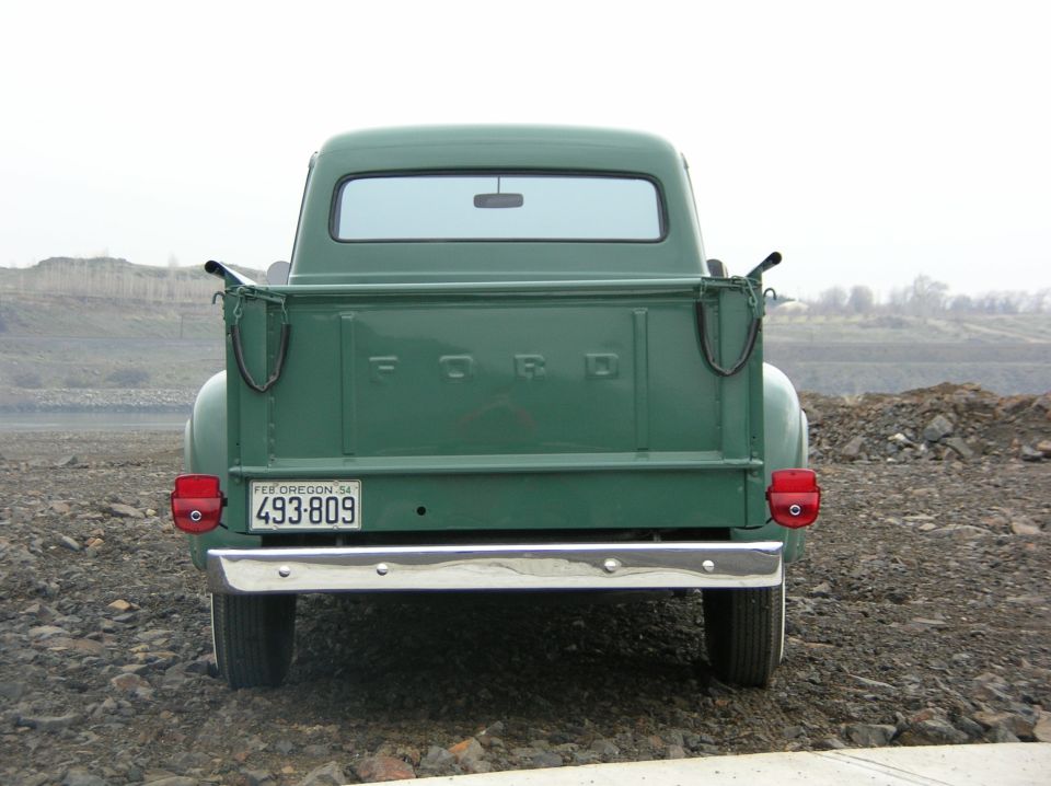 Green 1954 Ford F-250 pickup truck rear view, Oregon license plate 493-809